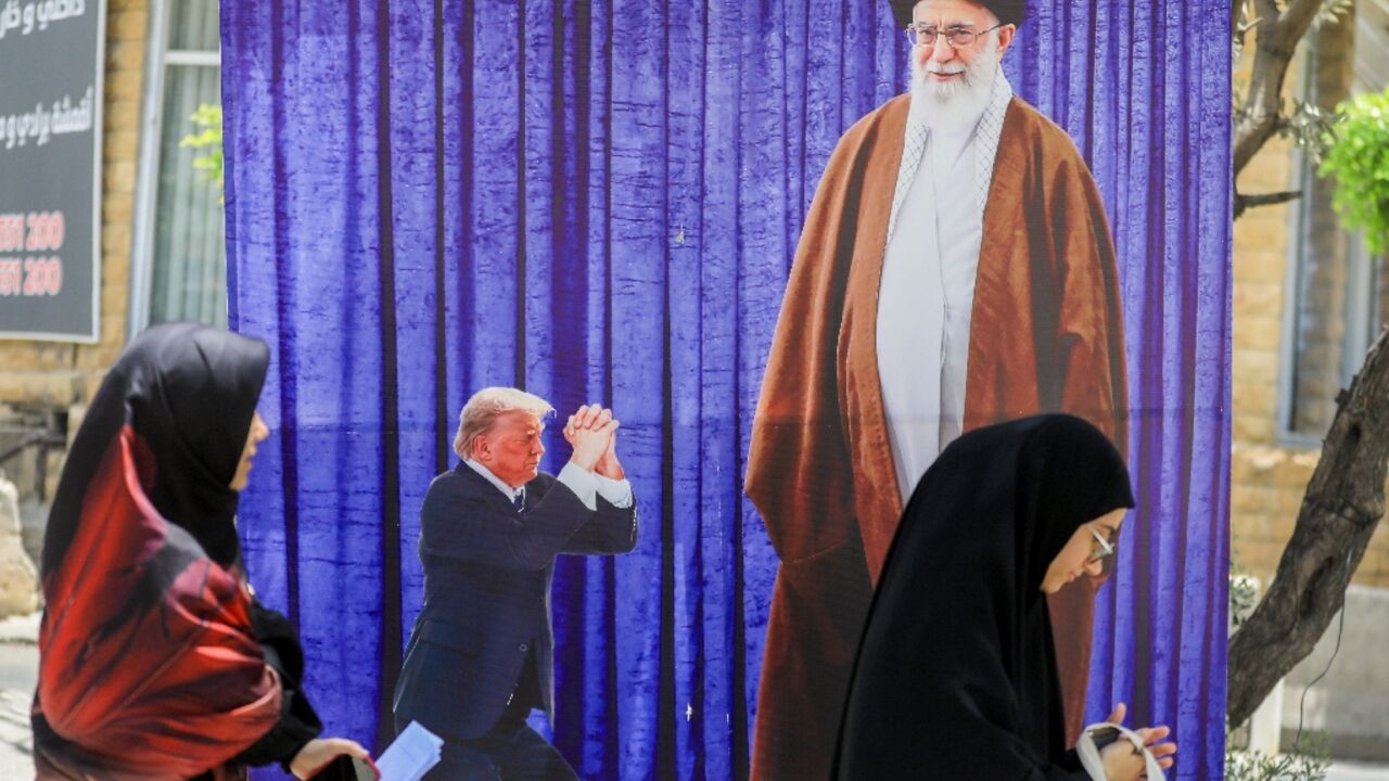 A poster depicting US President Donald Trump prostrating in front of Iran's Ayatollah Ali Kamenei hangs in a southern Beirut suburb A poster depicting US President Donald Trump prostrating in front of Iran's Ayatollah Ali Kamenei hangs in a southern Beirut suburb