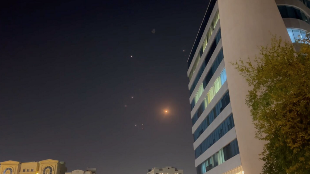 In this frame grab taken from a video, missiles and air-defense interceptors illuminate the night sky over Doha after Iran launched an attack on US forces at Al Udeid Air Base on June 23, 2025, in Doha, Qatar.