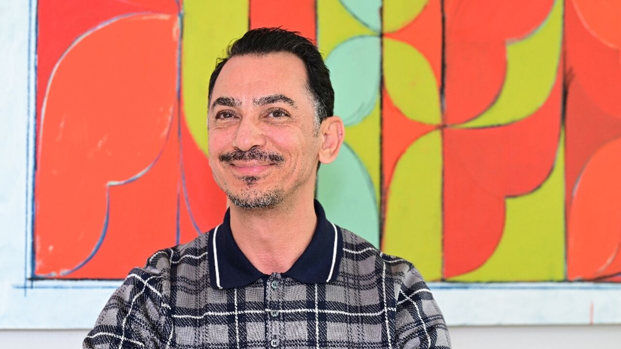 Rami Al Ali poses for a picture in his studio in Dubai on July 1, 2025. 