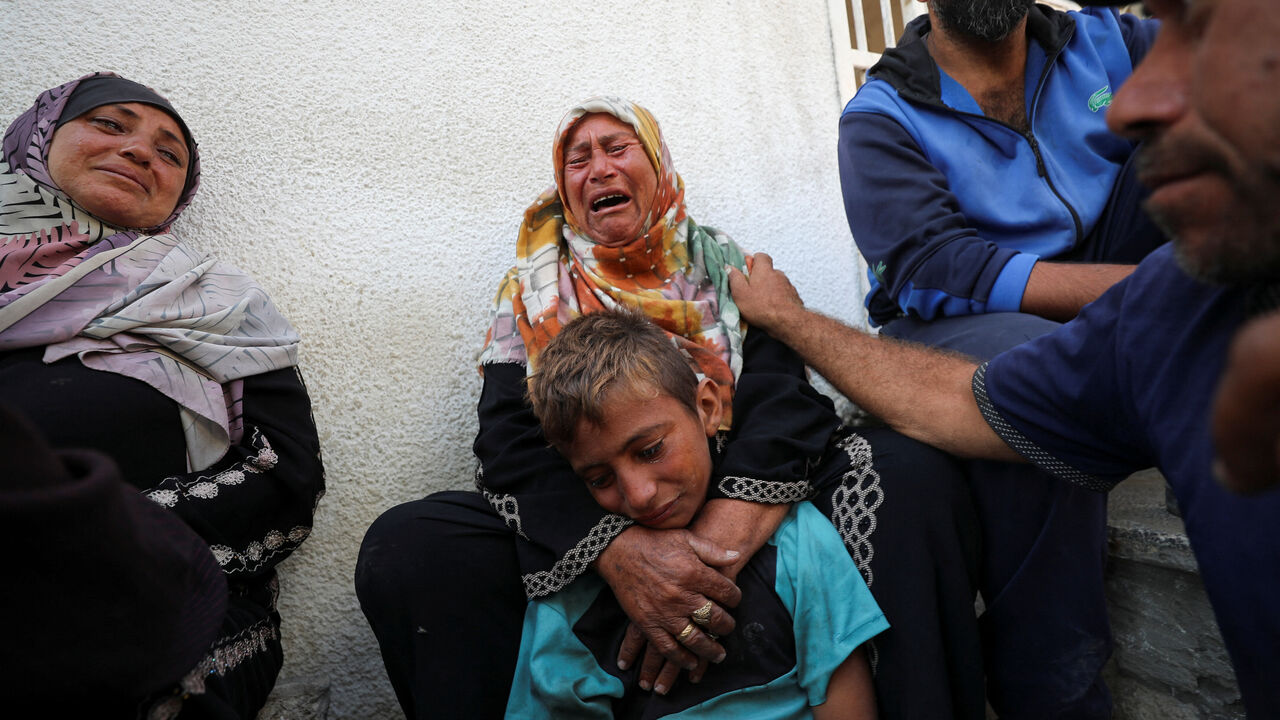 Mourners react during the funeral of Palestinians killed in overnight Israeli strikes, according to medics, at Al-Shifa hospital in Gaza City, July 17, 2025. REUTERS/Mahmoud Issa