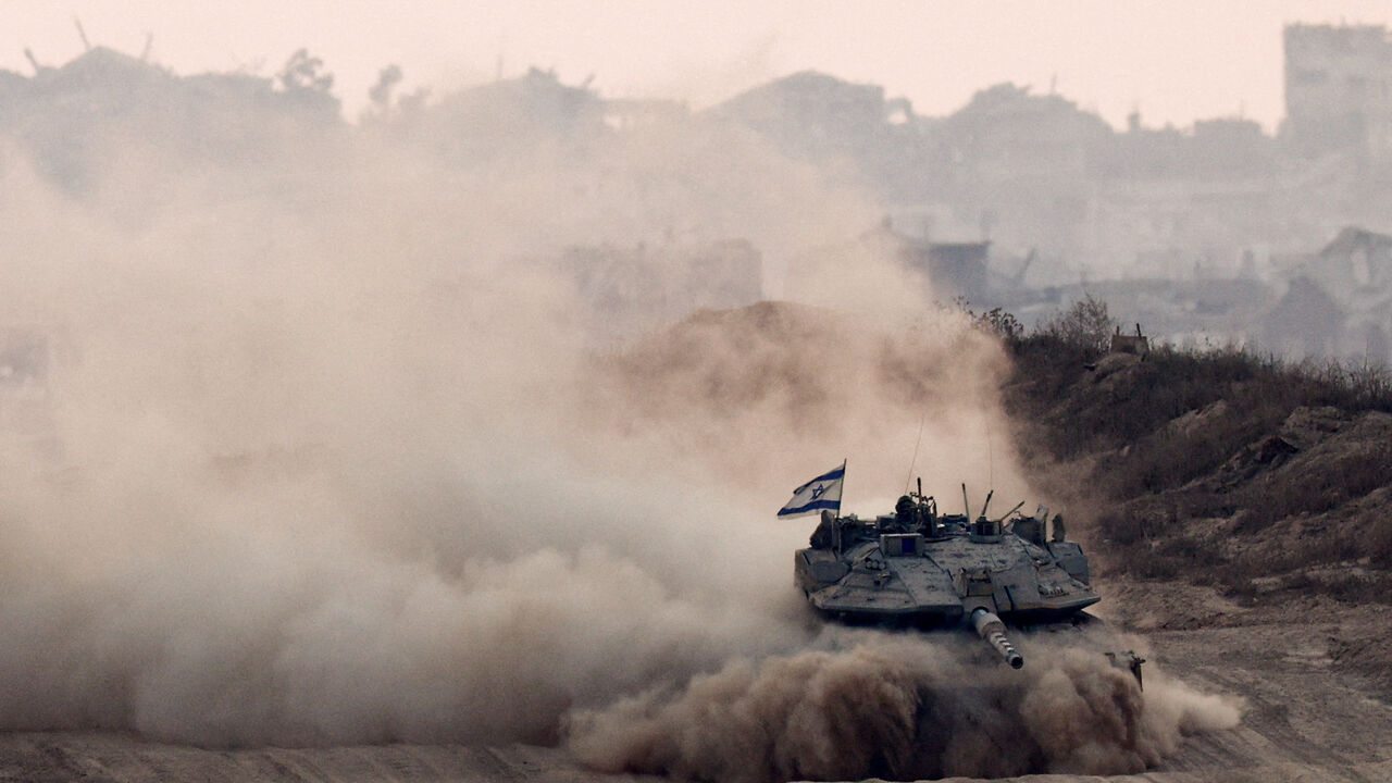 FILE PHOTO: An Israeli tank manoeuvres in Gaza, as seen from the Israeli side of the border, June 17. REUTERS/Amir Cohen/File Photo