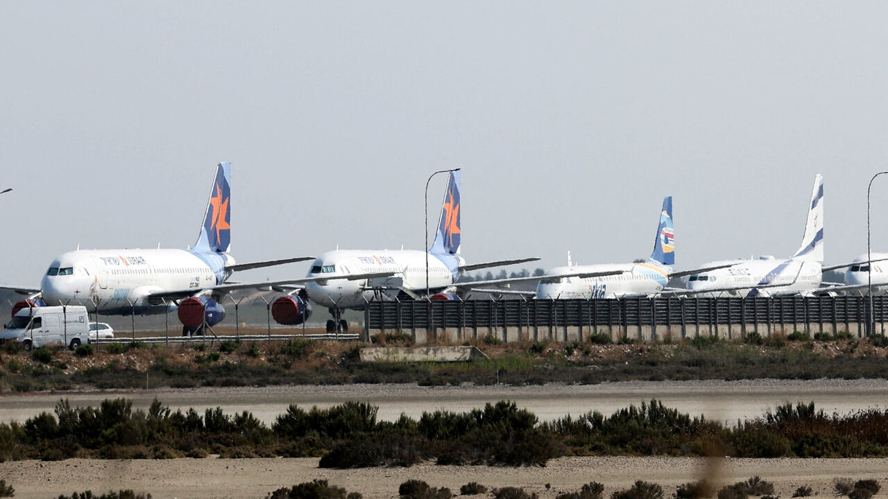 FILE PHOTO: Aircraft belonging to Israel's state carrier El Al and Israir among other airlines, are parked at Larnaca International Airport, in Larnaca, Cyprus June 16, 2025. REUTERS/Yiannis Kourtoglou/File Photo
