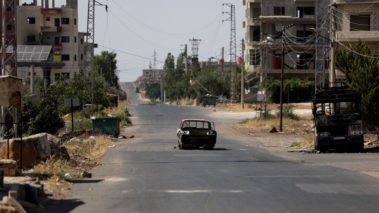 FILE PHOTO: A view shows remains of destroyed vehicles, following deadly clashes between Druze fighters, Sunni Bedouin tribes and government forces, in Syria's predominantly Druze city of Sweida, Syria July 25, 2025. REUTERS/Stringer/File Photo