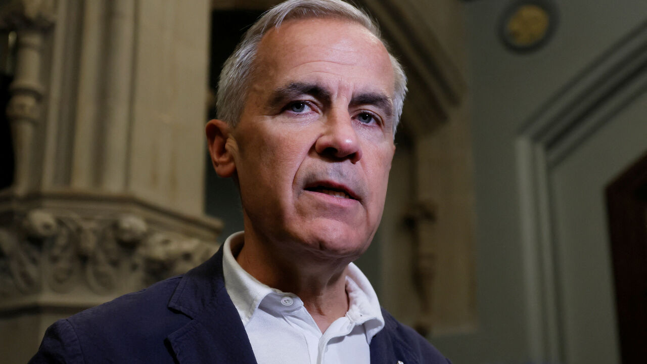 Canada's Prime Minister Mark Carney speaks to journalists outside his office on Parliament Hill in Ottawa, Ontario, Canada June 30, 2025. REUTERS/Blair Gable/File Photo