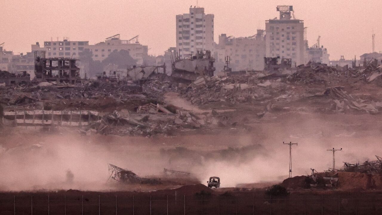 An Israeli military vehicle returning from the Gaza Strip into Israel An Israeli military vehicle returning from the Gaza Strip into Israel