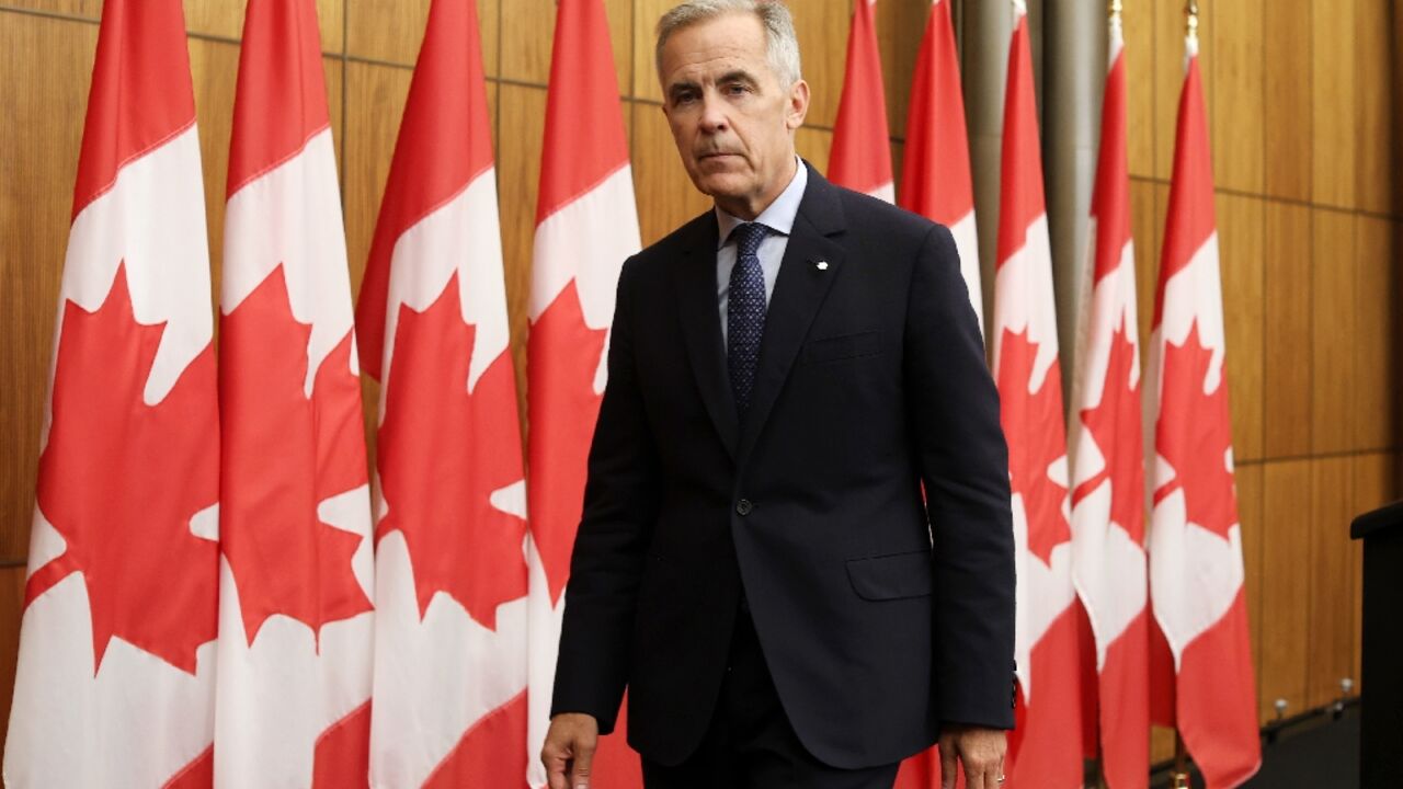 Canadian Prime Minister Mark Carney exits a press conference after announcing plans to recognize a Palestinian state Canadian Prime Minister Mark Carney exits a press conference after announcing plans to recognize a Palestinian state