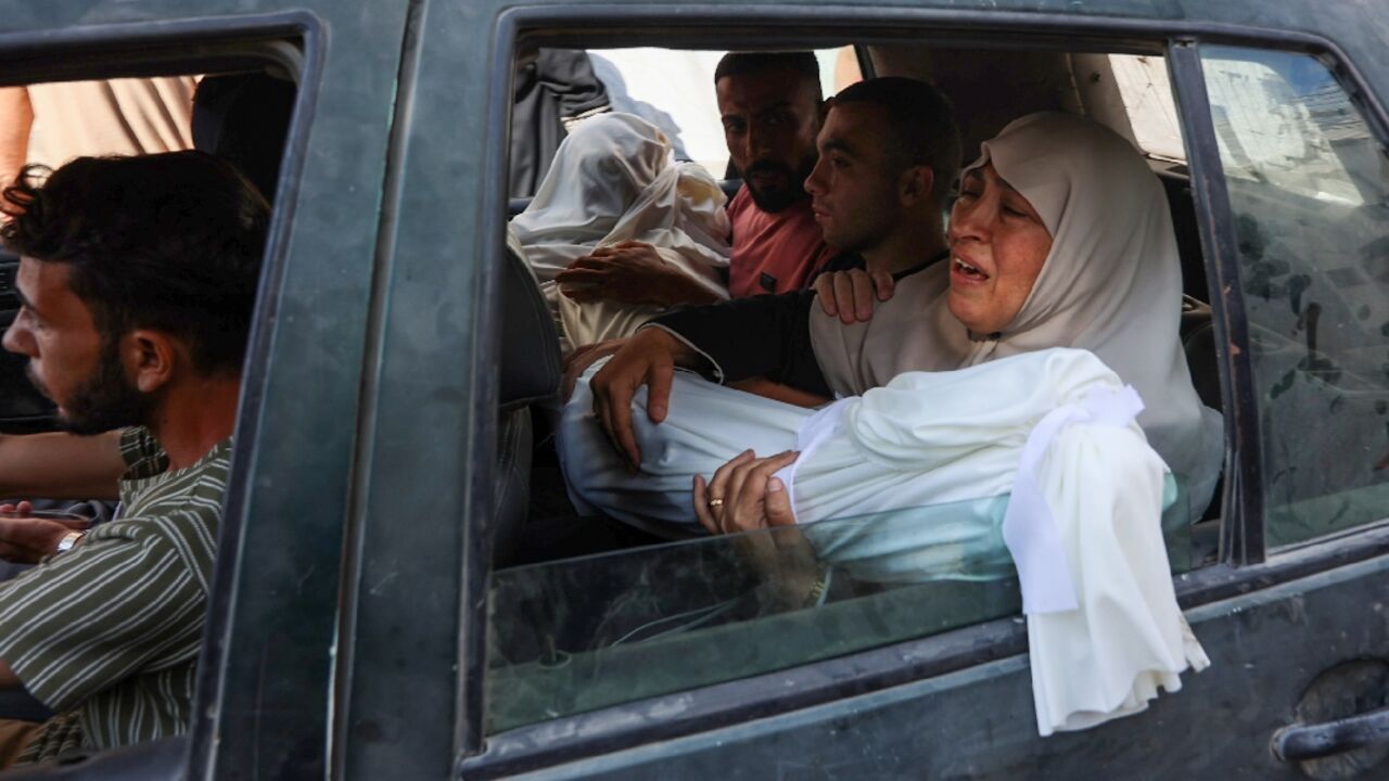 Crowds of mourners gathered at Gaza City's Al-Shifa hospital Crowds of mourners gathered at Gaza City's Al-Shifa hospital