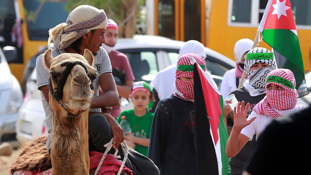 Supporters of Jordan's Muslim Brotherhood take part in a protest in the village of Sweimeh.
