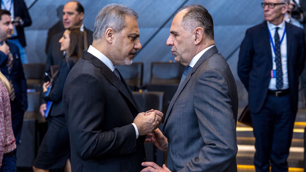 Giorgos Gerapetritis (L), foreign minister of Greece, speaks with Hakan Fidan (R), foreign minister of Turkey during the second meeting of North Atlantic Council of foreign ministers at NATO headquarters, Brussels, Dec. 4, 2024.