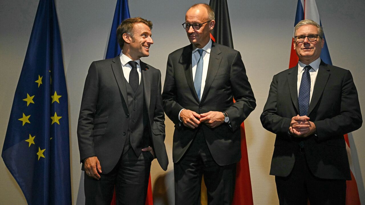 French President Emmanuel Macron, German Chancellor Friedrich Merz and British Prime Minister Keir Starmer pose for the media at a hotel prior to an E3 meeting on the sidelines of the 2025 NATO summit on June 24, 2025, in The Hague, Netherlands.