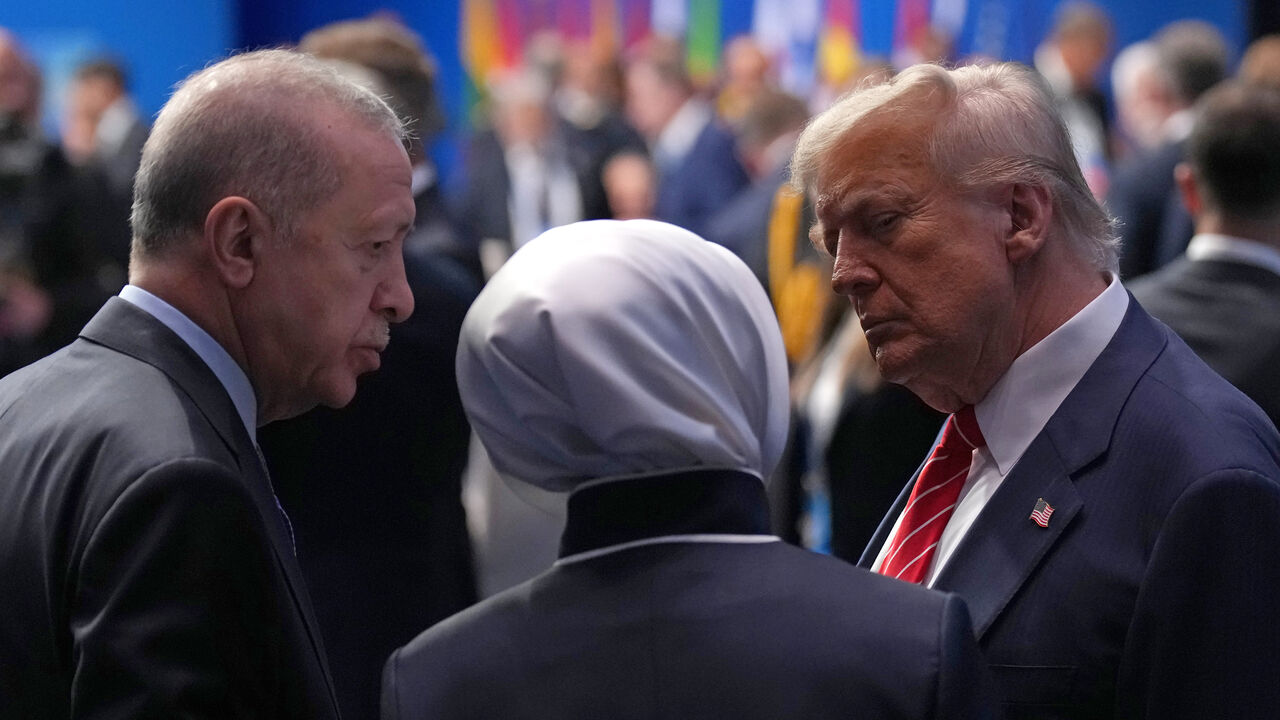THE HAGUE, NETHERLANDS - JUNE 25: U.S. President Donald Trump (R) speaks with President of the Republic of Türkiye, Recep Tayyip Erdogan (L), as they arrive for the North Atlantic Council Plenary Session on the second day of the 2025 NATO Summit on June 25, 2025 in The Hague, Netherlands. Among other matters, members are to approve a new defense investment plan that raises the target for defense spending to 5% of GDP. (Photo by Andrew Harnik/Getty Images)