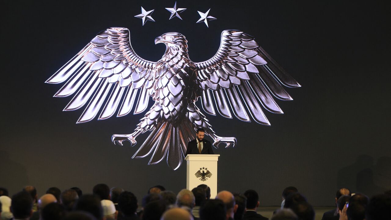 Syrian President Ahmad Al-Sharaa delivers a speech at the presidential palace during the unveiling of the country's new national emblem, Damascus, July 3, 2025.