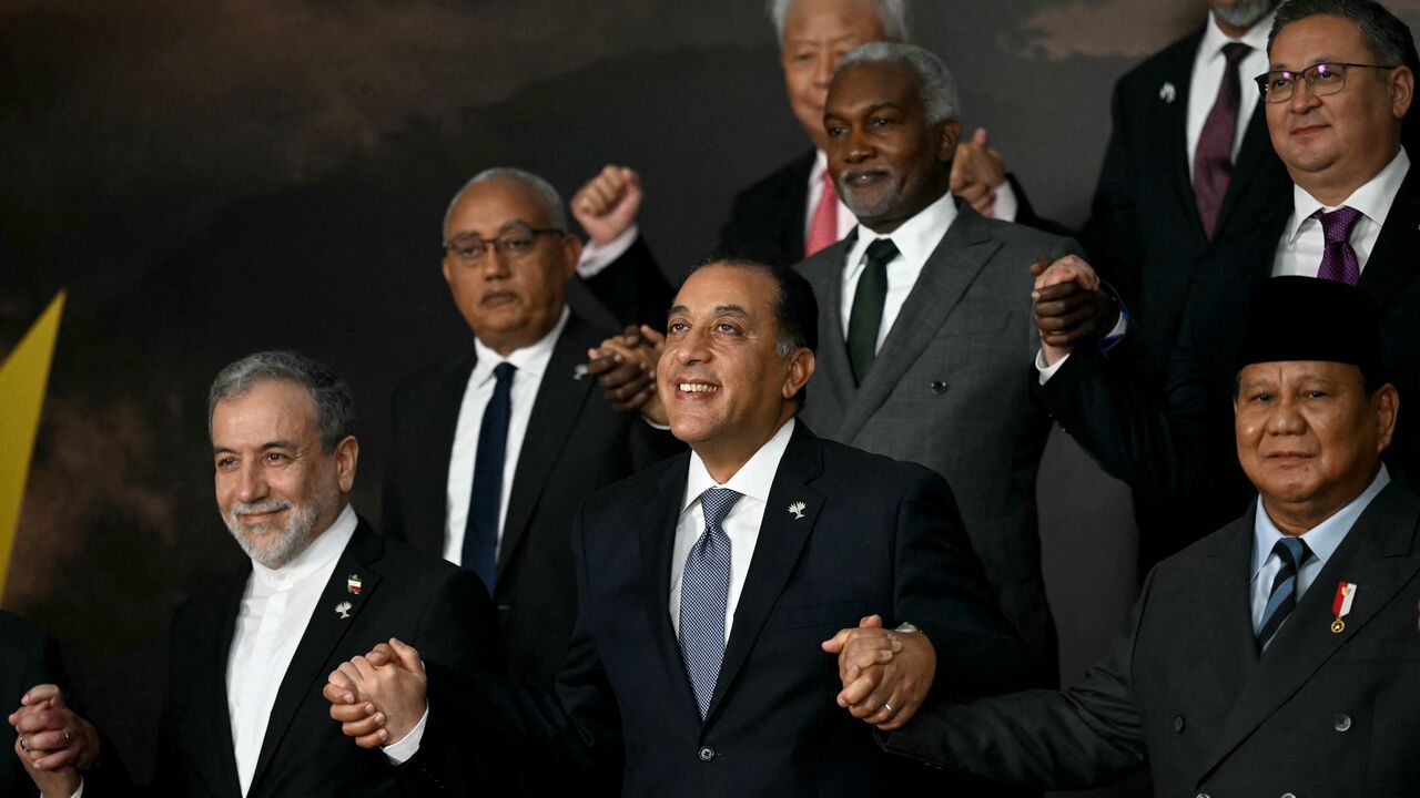 Iran's Foreign Minister Abbas Araghchi, Egypt's Prime Minister Mostafa Madbouly, and Indonesia's President Prabowo Subianto pose for a family photo.