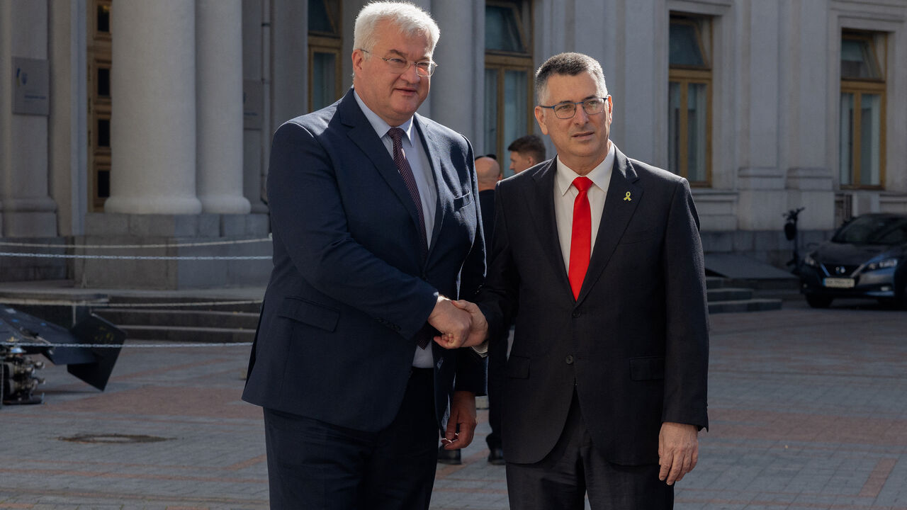 Ukraine's Foreign Minister Andriy Sybiga (L) shakes hands with Israel's Foreign Minister Gideon Sa'ar in Kyiv on July 23, 2025, amid the Russian invasion of Ukraine. (Photo by Tetiana DZHAFAROVA / AFP) (Photo by TETIANA DZHAFAROVA/AFP via Getty Images)