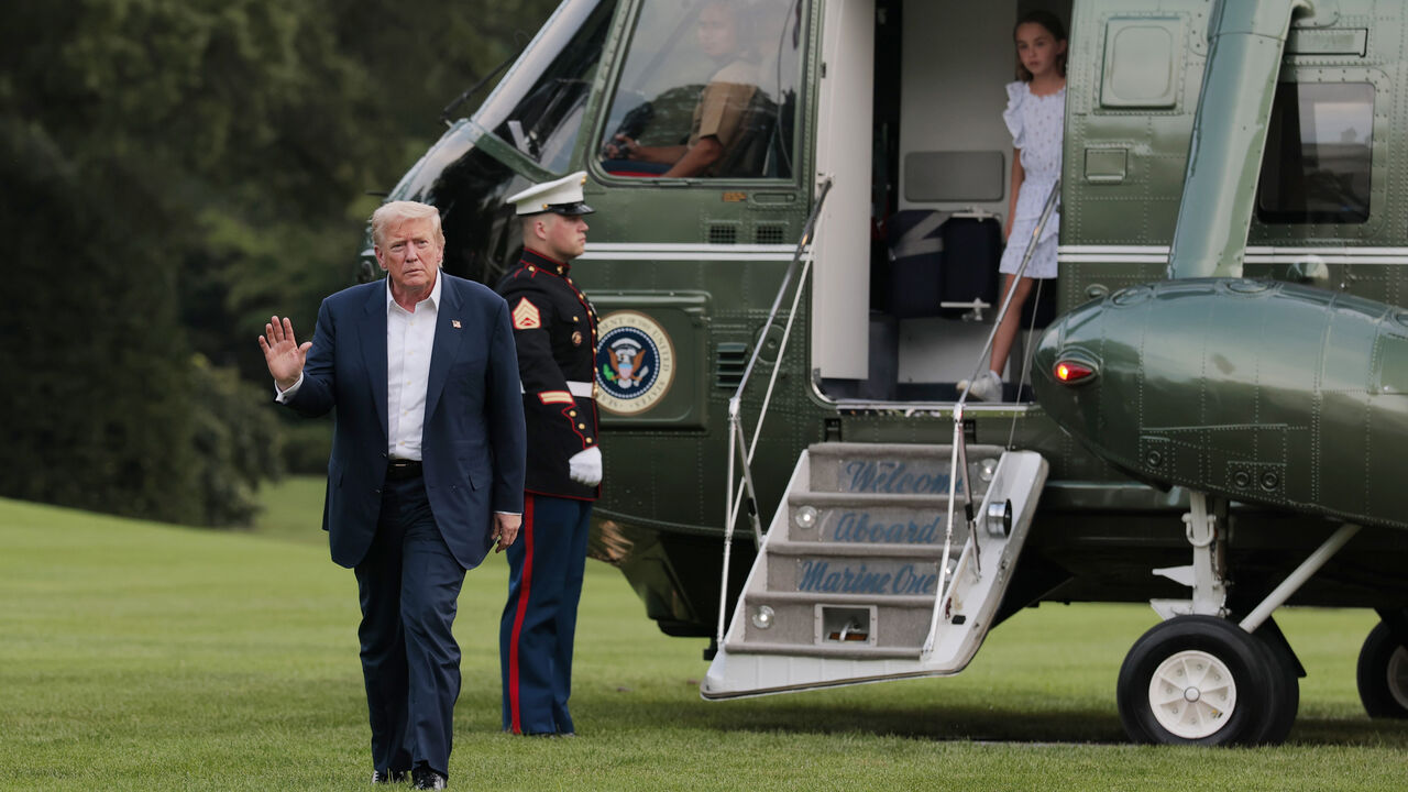WASHINGTON, DC - JULY 29: U.S. President Donald Trump walks across the South Lawn of the White House followed by granddaughter Chloe after returning on Marine One on July 29, 2025 in Washington, DC. President Trump returned to the White House with his family after a trip to Scotland that was part vacation, part work, as he stayed at his Trump Turnberry golf course, followed by Trump International Golf Links in Aberdeenshire, from July 25 to 29. (Photo by Anna Moneymaker/Getty Images)