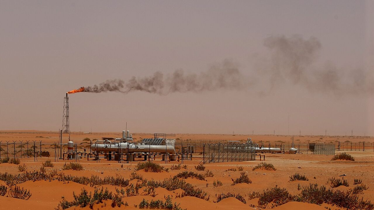 A flame from a Saudi Aramco oil instillation known as "Pump 3" is seen in the desert near the oil-rich area of Khouris, 160 kilometers east of the Saudi capital Riyadh, on June 23, 2008.