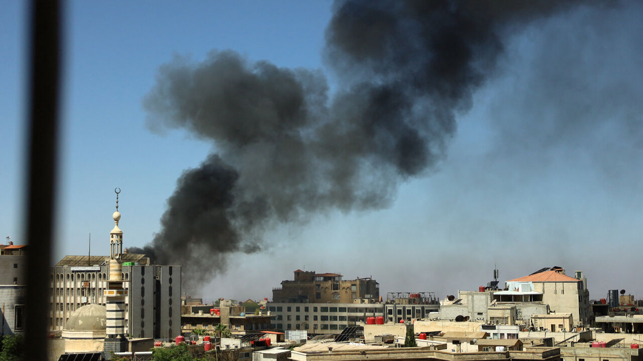 image of Suwayda, Syria with smoke billowing up from an explosion