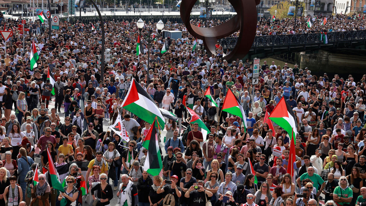 People hold flags during a demonstration in support of Palestinians, orgsanised by Palestinarekin Elkartasuna (Solidarity With Palestine), in Bilbao, Spain, October 5, 2024. REUTERS/Vincent West