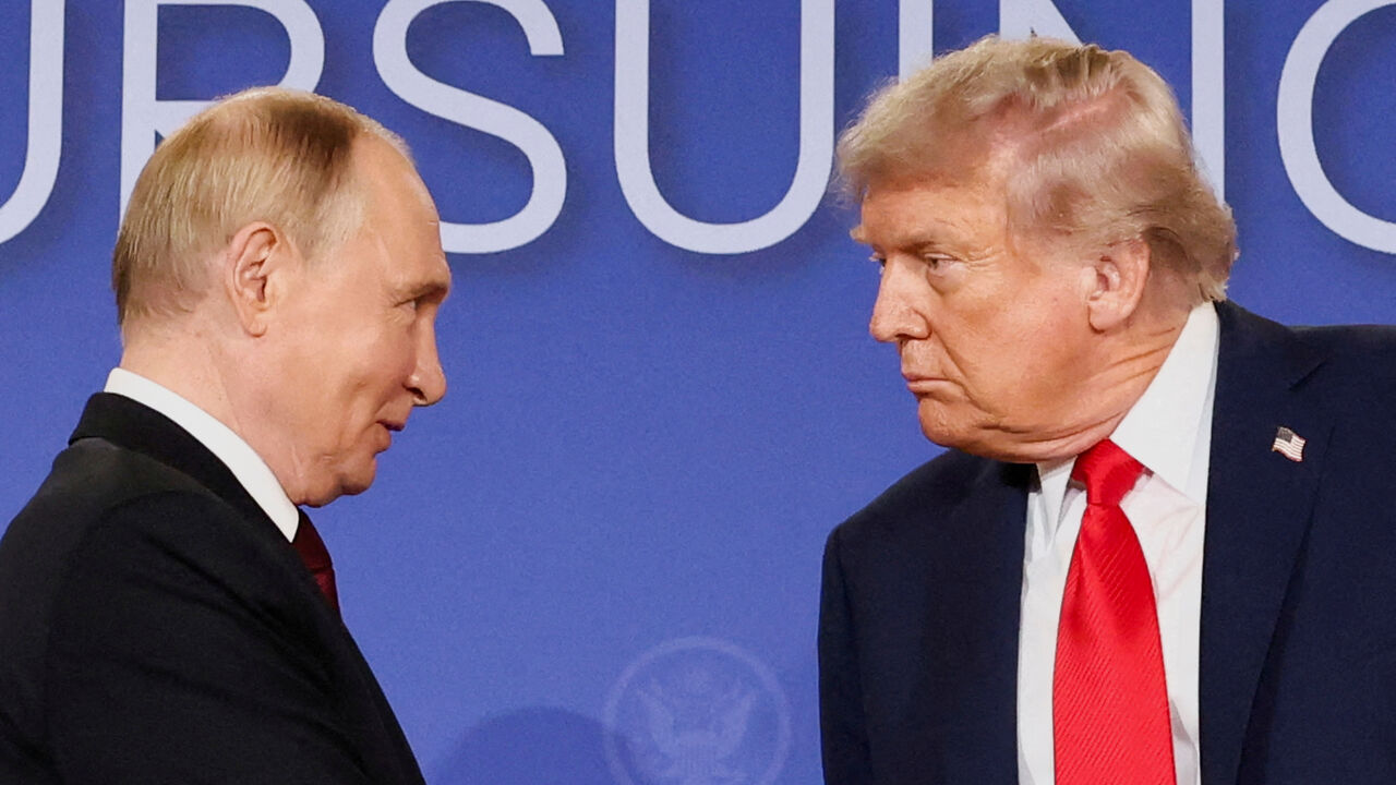 FILE PHOTO: U.S. President Donald Trump and Russian President Vladimir Putin look at each other during a press conference following their meeting to negotiate an end to the war in Ukraine, at Joint Base Elmendorf-Richardson, in Anchorage, Alaska, U.S., August 15, 2025. REUTERS/Kevin Lamarque/File Photo