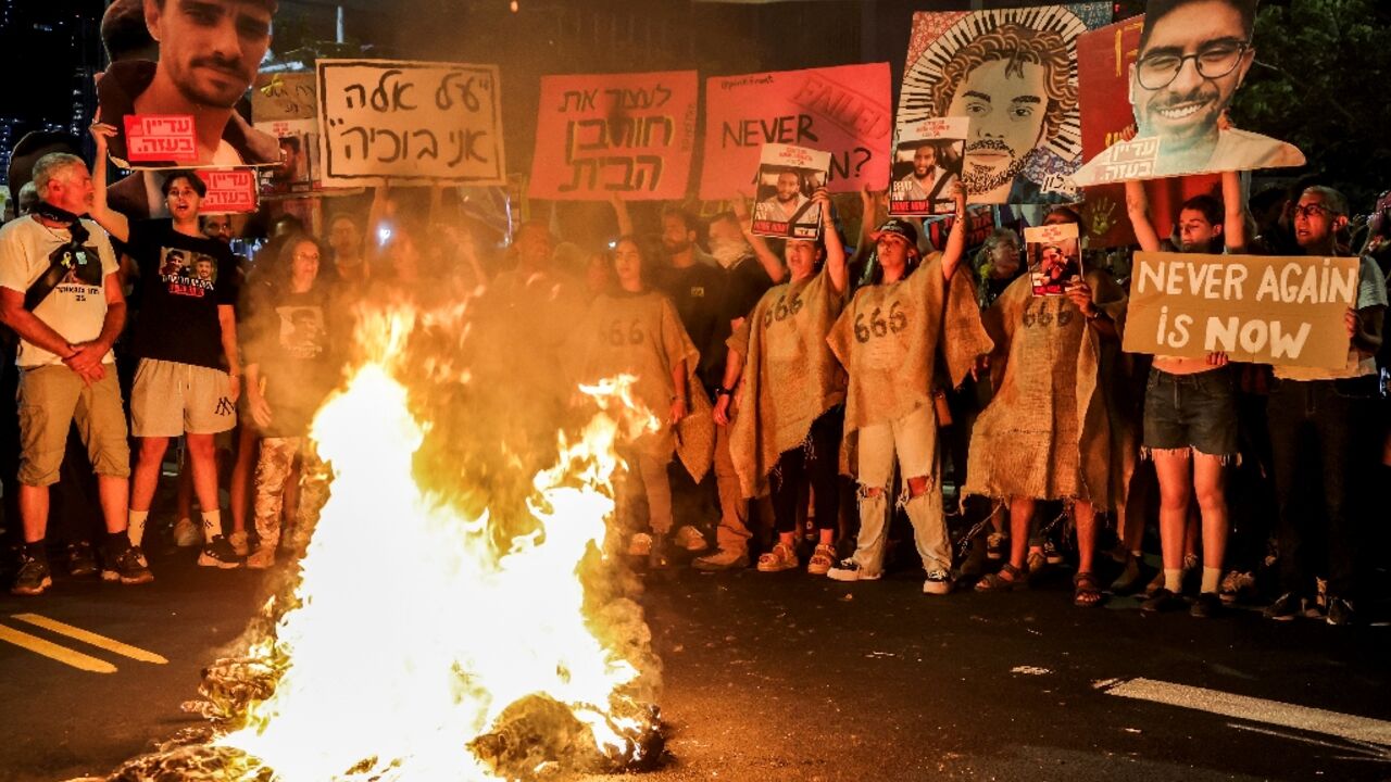 Demonstrators in Tel Aviv call for action to secure the release of hostages held in Gaza, after Palestinian groups released videos of two captives Demonstrators in Tel Aviv call for action to secure the release of hostages held in Gaza, after Palestinian groups released videos of two captives