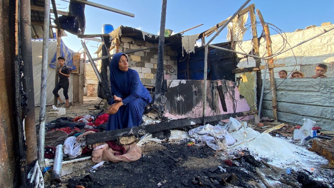 A Palestinian woman at the site of Israeli bombardment on the Al-Mawasi area in the southern Gaza Strip A Palestinian woman at the site of Israeli bombardment on the Al-Mawasi area in the southern Gaza Strip