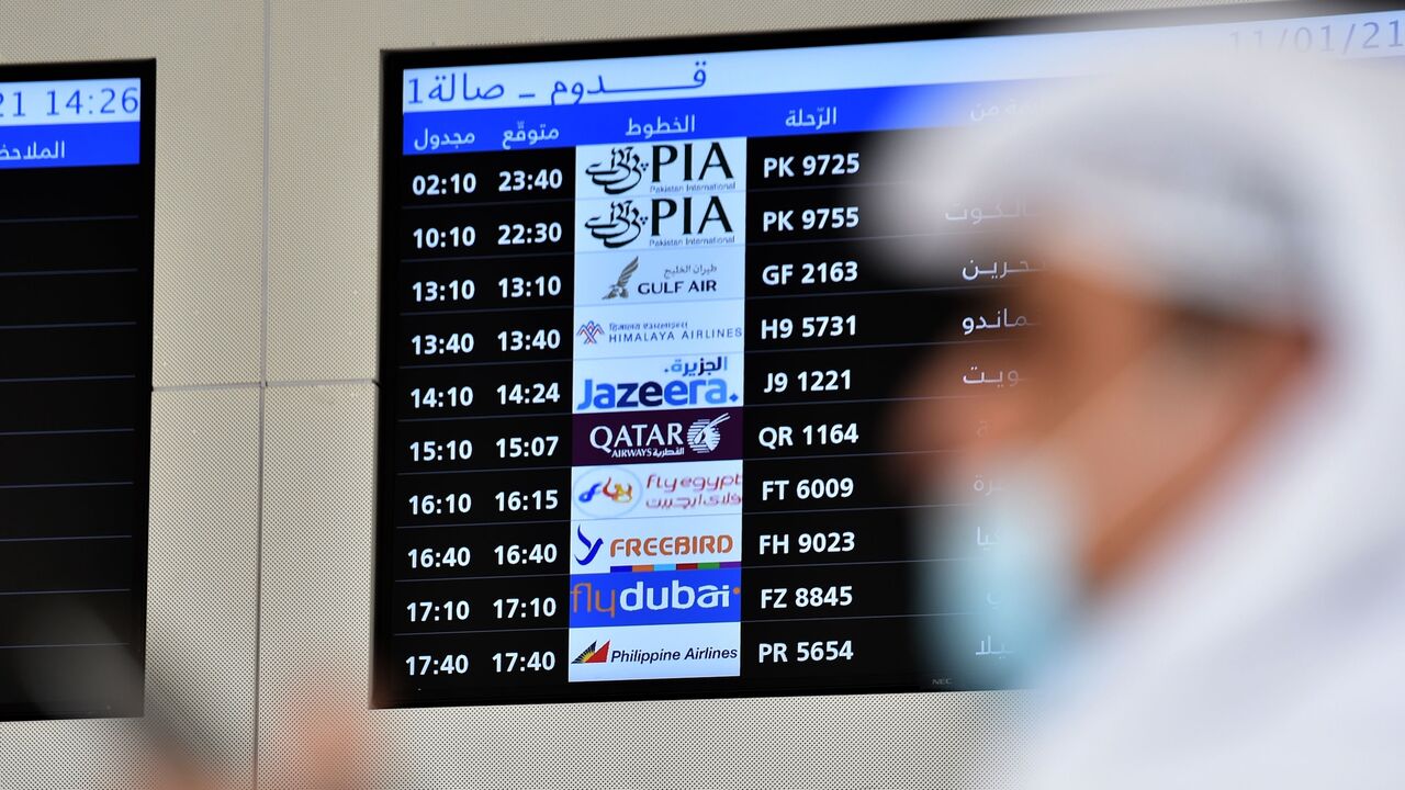 People wait for the arrival of relatives at King Khalid International Airport in the Saudi capital of Riyadh on the first commercial flight from Qatar on Jan. 11, 2021. 
