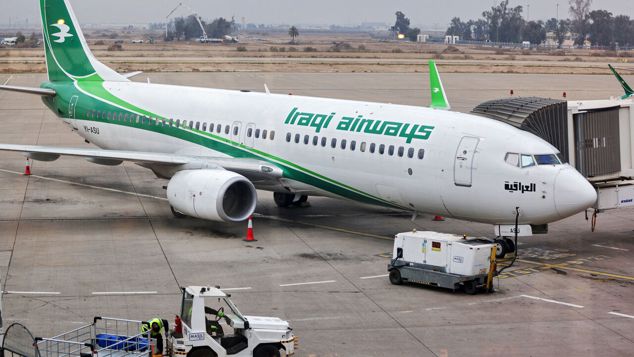 An Iraqi Airways aircraft is parked at the gate at Baghdad airport on Feb. 20, 2025.