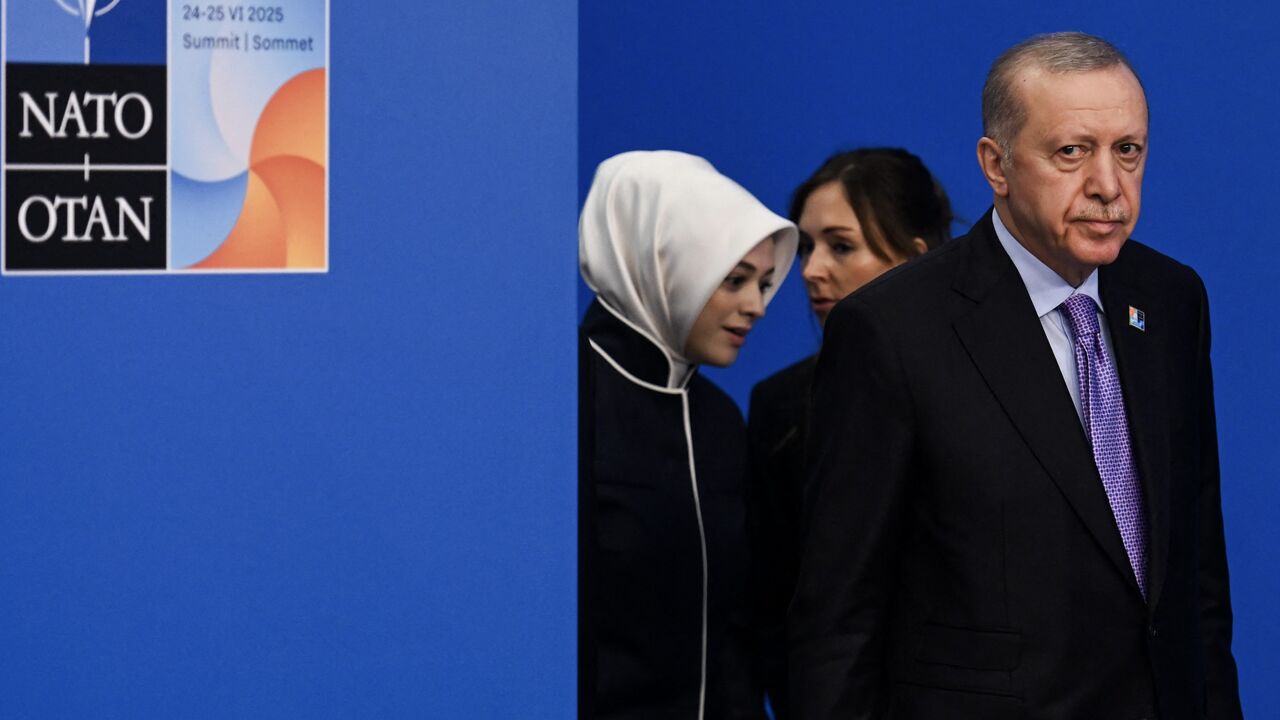Turkey's President Recep Tayyip Erdogan (R) arrives for the North Atlantic Treaty Organization (NATO) Heads of State and Government summit in The Hague, on June 25, 2025.