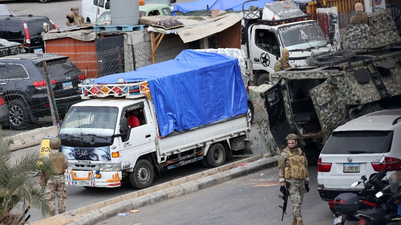 Trucks loaded with Palestinian weapons pull out of the Burj al-Barajneh camp in the Lebanese capital, completing the disarmament of Palestine Liberation Organisation factions in Beirut refugee camps. Trucks loaded with Palestinian weapons pull out of the Burj al-Barajneh camp in the Lebanese capital, completing the disarmament of Palestine Liberation Organisation factions in Beirut refugee camps.