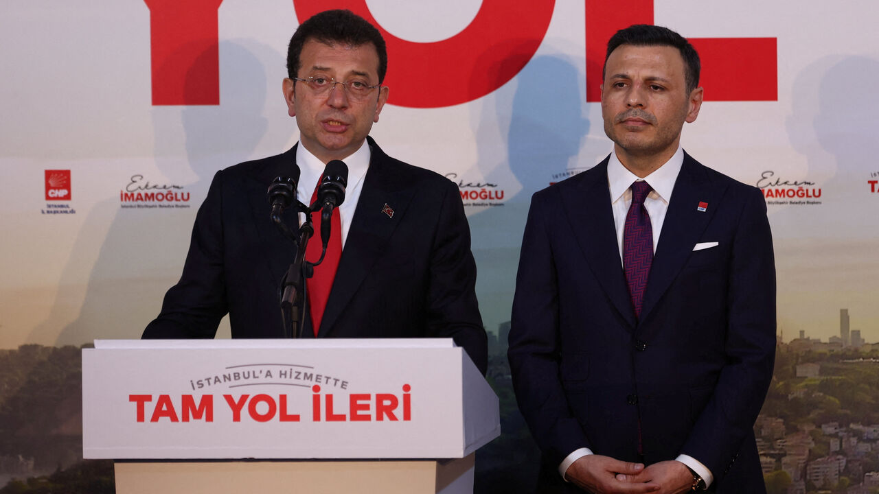 FILE PHOTO: Istanbul Mayor Ekrem Imamoglu, mayoral candidate of the main opposition Republican People's Party (CHP), accompanied by CHP Istanbul Provincial Chairman Ozgur Celik, talks to media at his party's local headquarters in Istanbul, Turkey March 31, 2024. REUTERS/Murad Sezer/File photo