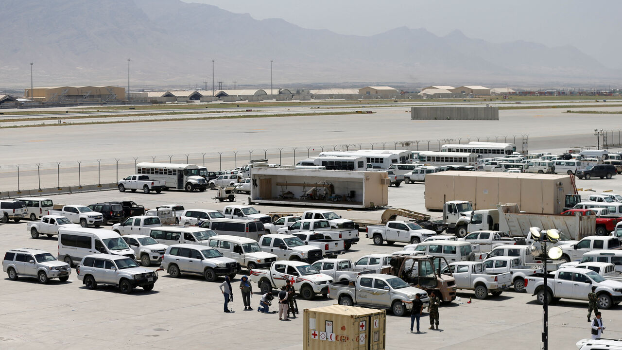 FILE PHOTO: Parked vehicles are seen in Bagram U.S. air base, after American troops vacated it, in Parwan province, Afghanistan July 5, 2021. REUTERS/Mohammad Ismail/File Photo