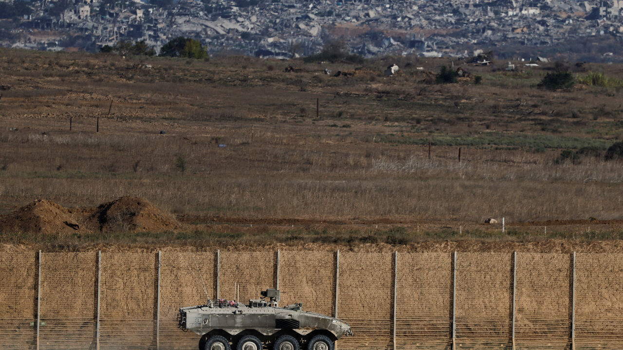 An Israeli armoured personnel carrier (APC) manoeuvres on Israeli side of the Israel-Gaza border, in Israel, September 30, 2025. REUTERS/Amir Cohen
