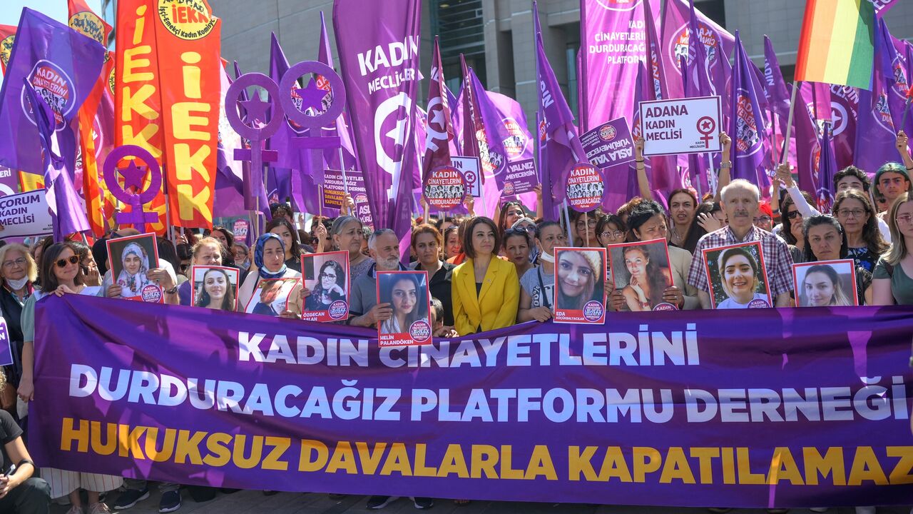 Women's rights activists and relatives of victims of feminicide wait outside the Istanbul court ahead of a hearing on June 1, 2022. 