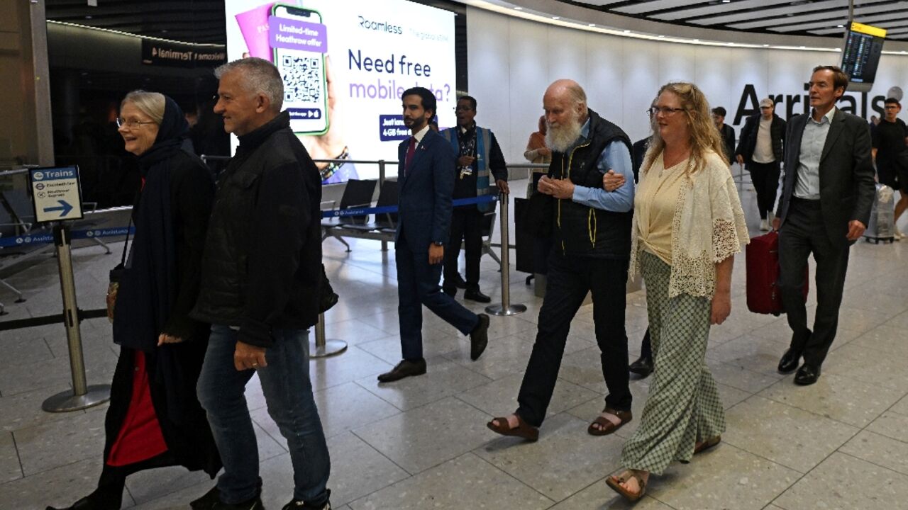 Peter Reynolds, 80, and his wife Barbie, 76, walk through arrivals at London's Heathrow airport accompanied by their daughter Sarah Entwhistle as they arrived back in the UK following their release by the Taliban Peter Reynolds, 80, and his wife Barbie, 76, walk through arrivals at London's Heathrow airport accompanied by their daughter Sarah Entwhistle as they arrived back in the UK following their release by the Taliban
