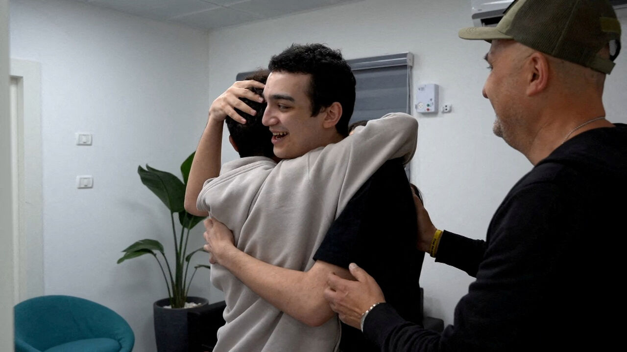 Edan Alexander, who has been released from captivity by Hamas, after he had been kidnapped during the deadly October 7, 2023 attack on Israel, embraces his brother as he reunites with his family in Reim, southern Israel, before flying to Tel Aviv May 12, 2025. GPO/Handout via REUTERS