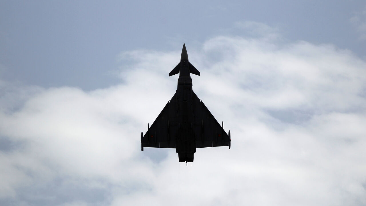 A Eurofighter Typhoon fighter jet flies vertically over a beach during an airshow in Torre del Mar, southern Spain, July 31, 2016. REUTERS/Jon Nazca