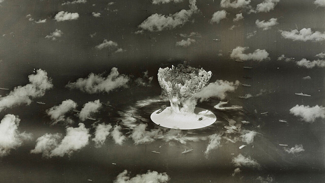FILE PHOTO: A mushroom cloud rises with ships below during Operation Crossroads nuclear weapons test on Bikini Atoll, Marshall Islands in this 1946 handout provided by the U.S. Library of Congress.  The United States said on April 25, 2014, it was examining lawsuits filed by the Marshall Islands against it and eight other nuclear-armed countries that accuse them of failing in their obligation to negotiate nuclear disarmament.  REUTERS/U.S. Library of Congress/Handout via Reuters/File Photo