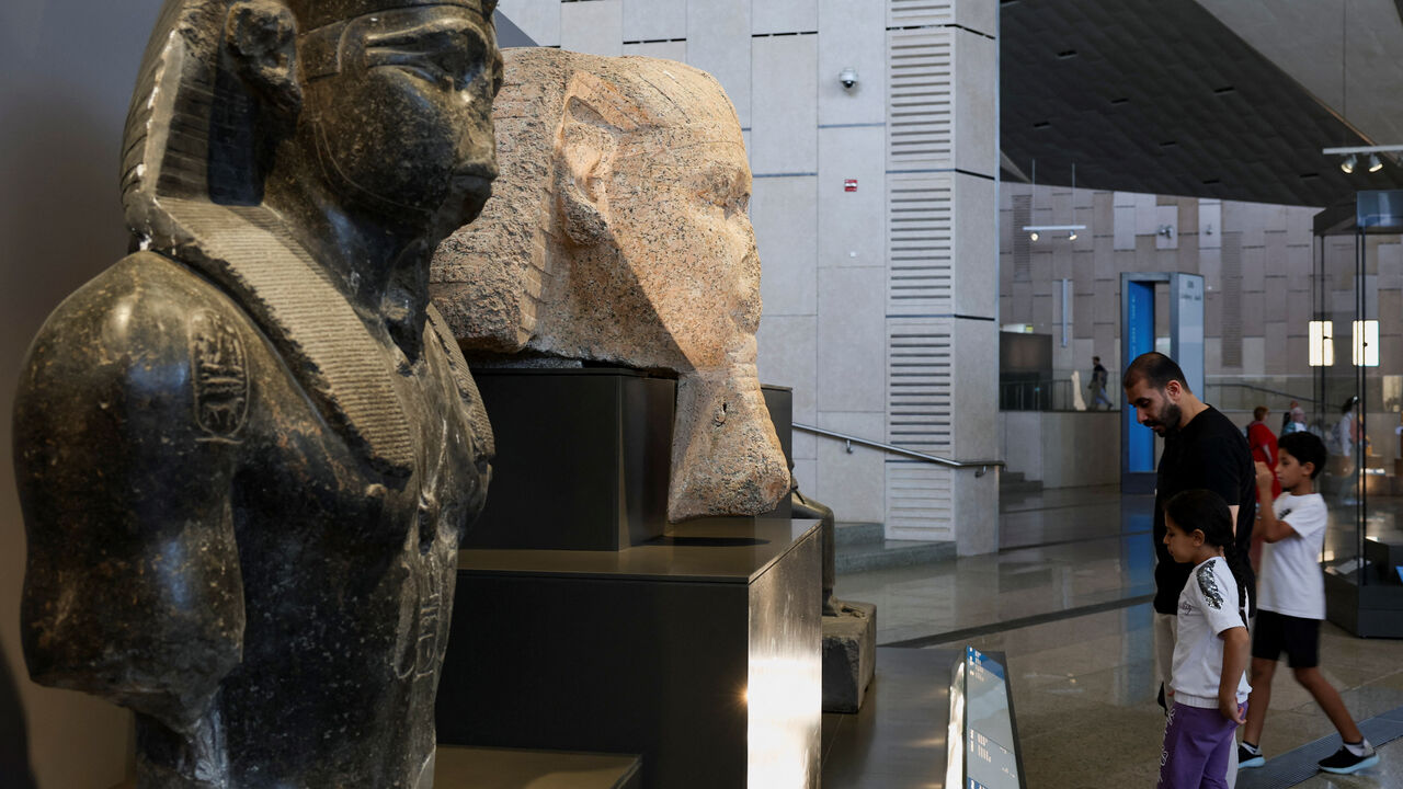 Egyptians look at exhibits at the Grand Egyptian Museum (GEM), which is scheduled to officially open on November 1, 2025, following a partial opening last year, in Giza, Egypt, June 2, 2025. Egyptian officials hope the opening of the Grand Egyptian Museum will give a major boost to the tourism industry, providing an injection of foreign currency needed to keep the pound stable and ward off inflation. REUTERS/Amr Abdallah Dalsh