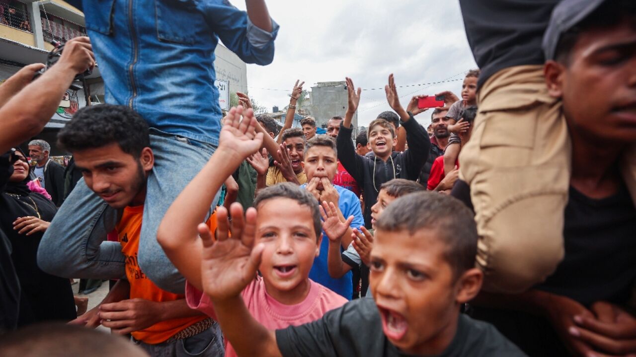 Palestinian children celebrate in Khan Yunis on October 9, 2025, following news of a new Gaza ceasefire deal Palestinian children celebrate in Khan Yunis on October 9, 2025, following news of a new Gaza ceasefire deal
