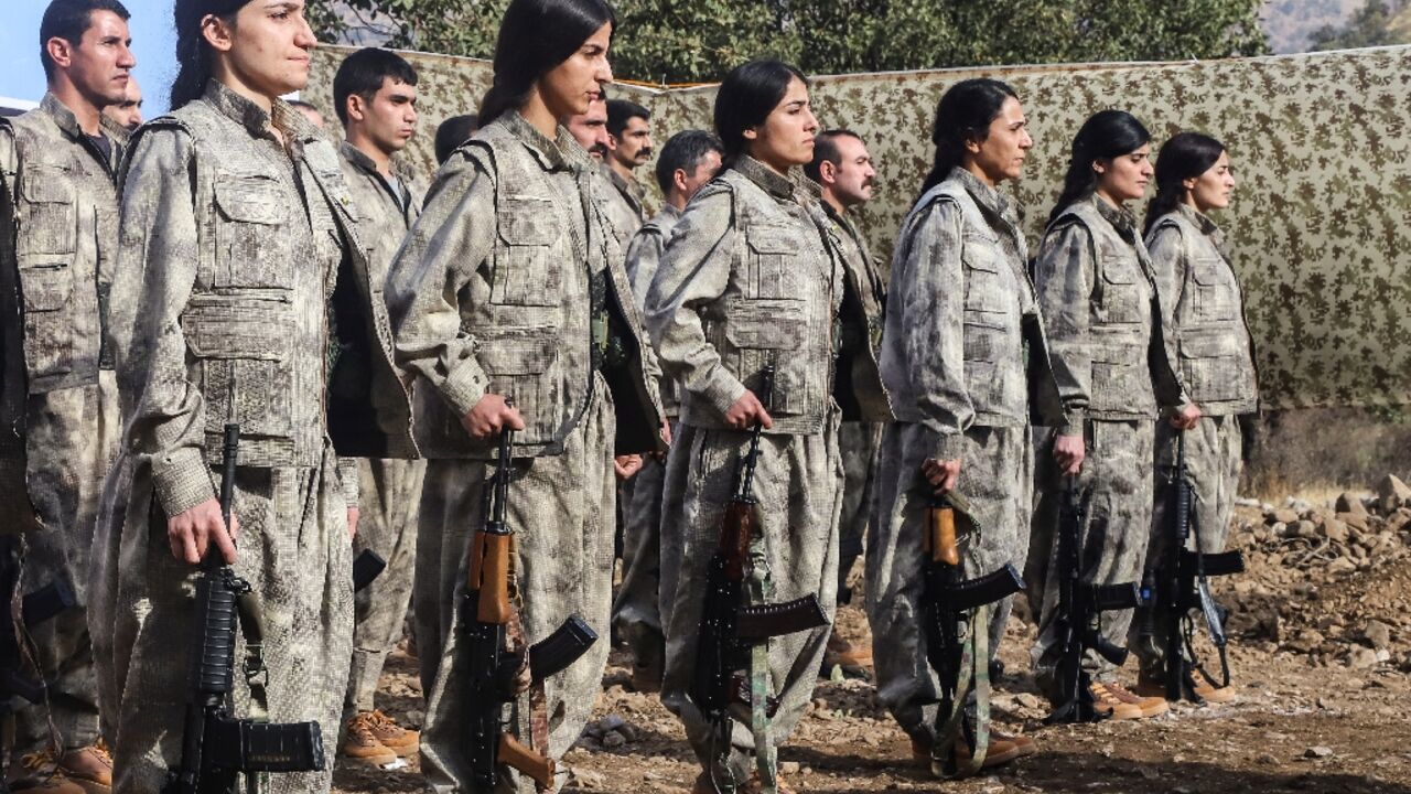 A first group of 25 PKK fighters who had left Turkey for northern Iraq were at the ceremony, among them eight women A first group of 25 PKK fighters who had left Turkey for northern Iraq were at the ceremony, among them eight women