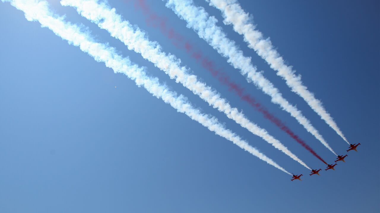 Turkish air force fighter jets fly over a parade during celebrations marking the 50th anniversary of Turkey's invasion of Cyprus on July 20, 2024, in occupied northern Nicosia, Cyprus.