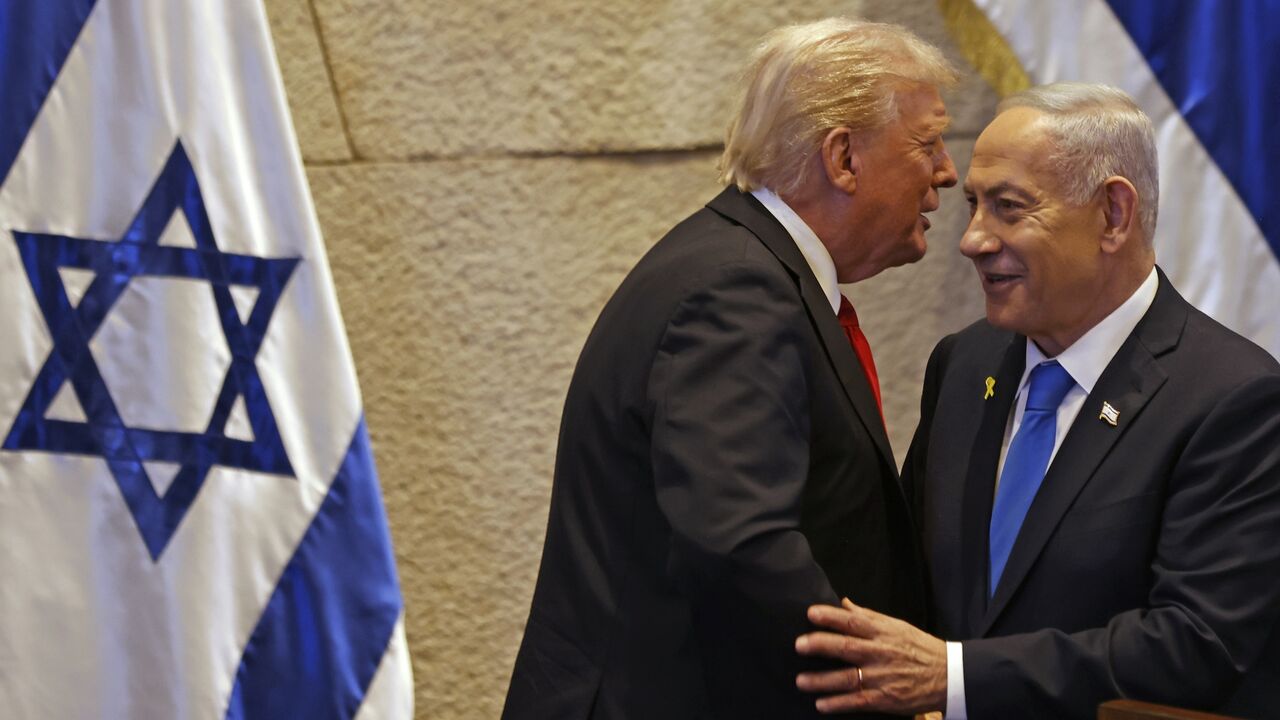 US President Donald Trump speaks with Israel's Prime Minister Benjamin Netanyahu in the Knesset, Israel's parliament, on Oct. 13, 2025, in Jerusalem.