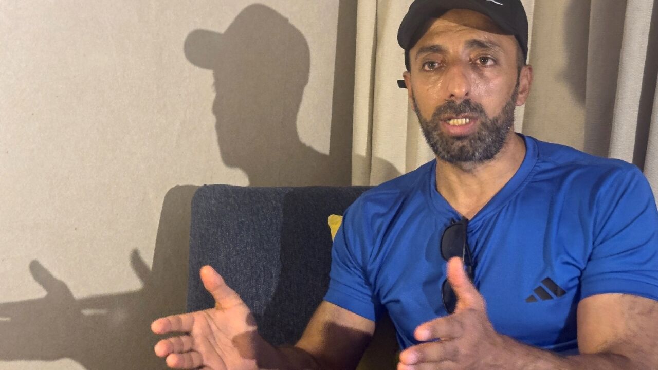 Murad Abu al-Rub, an exiled Palestinian prisoner in Egypt, speaks to AFP from his hotel room  