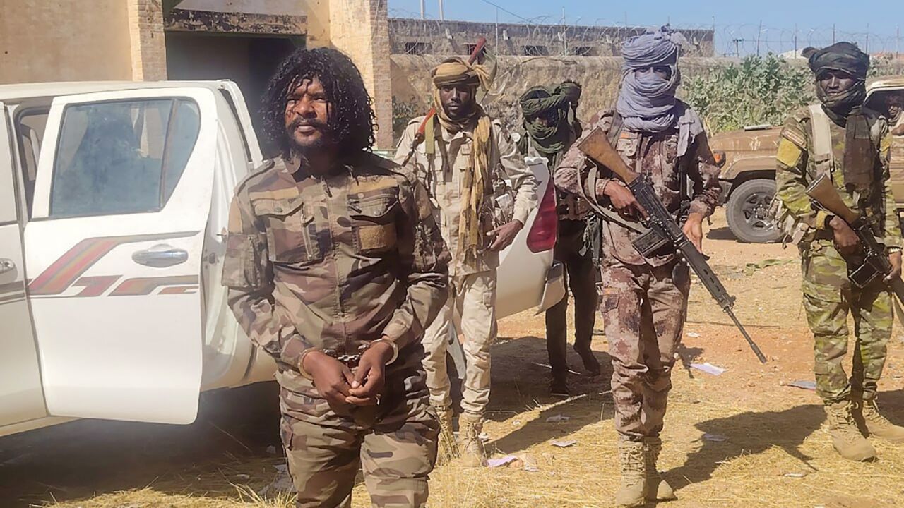 A photo released by the RSF purportedly shows its members detaining a fighter known as Abu Lulu (L) who was seen in execution videos from El-Fasher