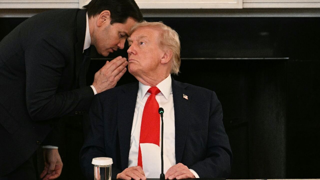 US Secretary of State Marco Rubio whispers in the ear of President Donald Trump during a roundtable about Antifa in the State Dining Room of the White House US Secretary of State Marco Rubio whispers in the ear of President Donald Trump during a roundtable about Antifa in the State Dining Room of the White House