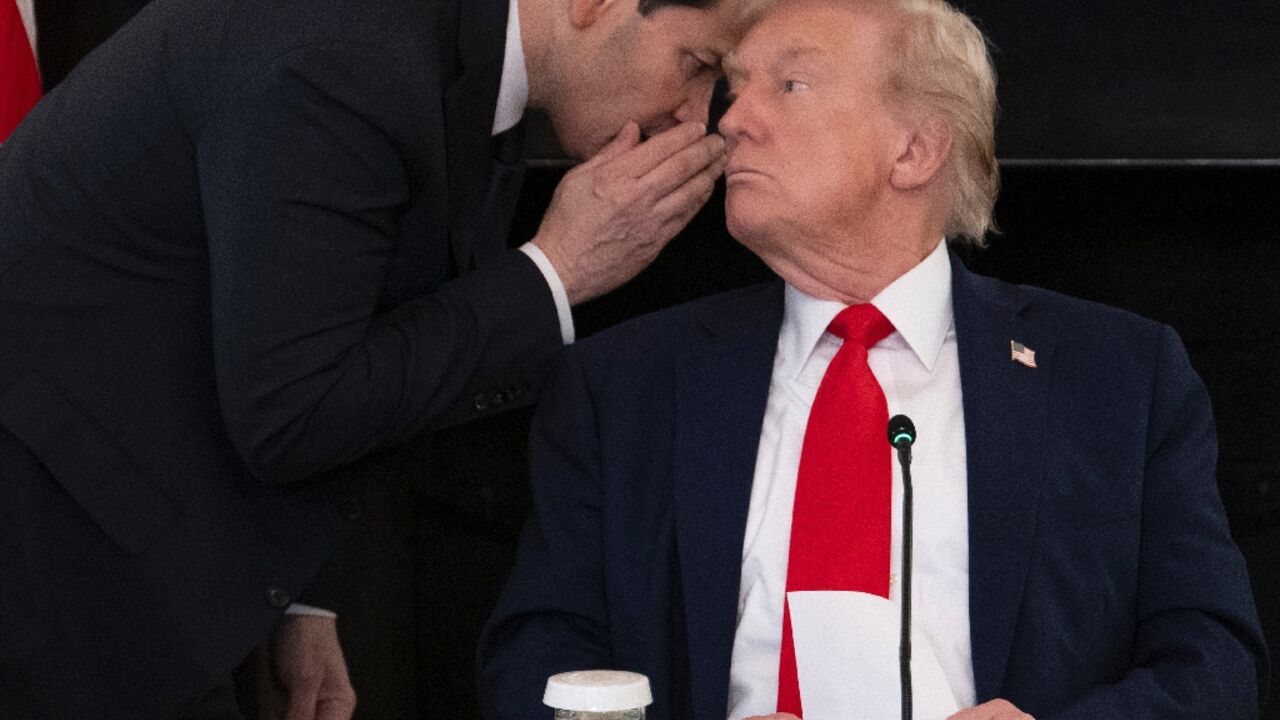 US Secretary of State Marco Rubio whispers to President Donald Trump at the White House after handing him a note saying the Middle East peace deal is 'very close' US Secretary of State Marco Rubio whispers to President Donald Trump at the White House after handing him a note saying the Middle East peace deal is 'very close'