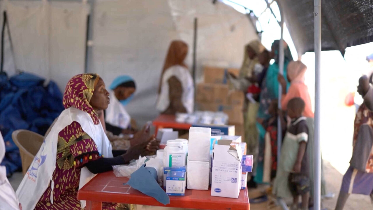 A medic waits in a makeshift clinic as displaced Sudanese gather after fleeing Al-Fashir city in Darfur, in Tawila, Sudan, October 29, 2025, in this still image taken from a Reuters' video. REUTERS/Mohamed Jamal