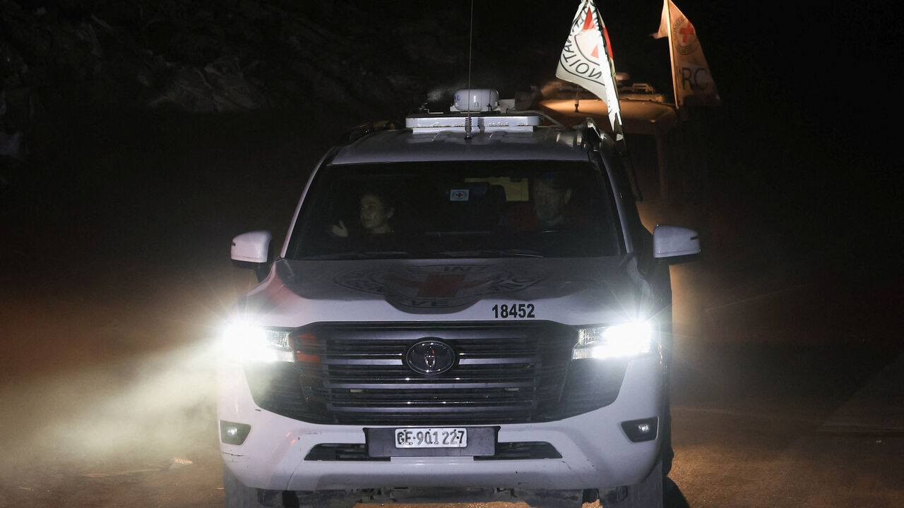 A Red Cross vehicle transports a body, after Hamas said that it found the body of an Israeli hostage soldier on Tuesday and prepares to return it to Israel through the Red Cross, in Gaza City, November 4, 2025. REUTERS/Dawoud Abu Alkas