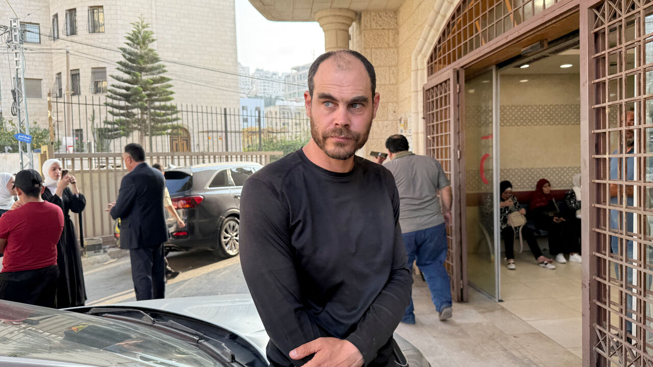 Jonathan Pollak, an Israeli rights activist who witnessed the incident, stands outside a hospital following an Israeli settlers attack near Nablus in the Israeli-occupied West Bank, November 8, 2025. REUTERS/Nidal Eshtayeh