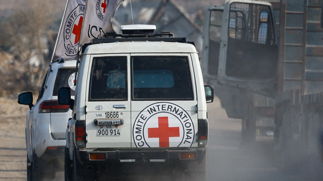 Red Cross vehicles transport a body, identified by Hamas as deceased Israeli soldier Hadar Goldin, in Deir Al-Balah, central Gaza Strip, November 9, 2025. REUTERS/Mahmoud Issa